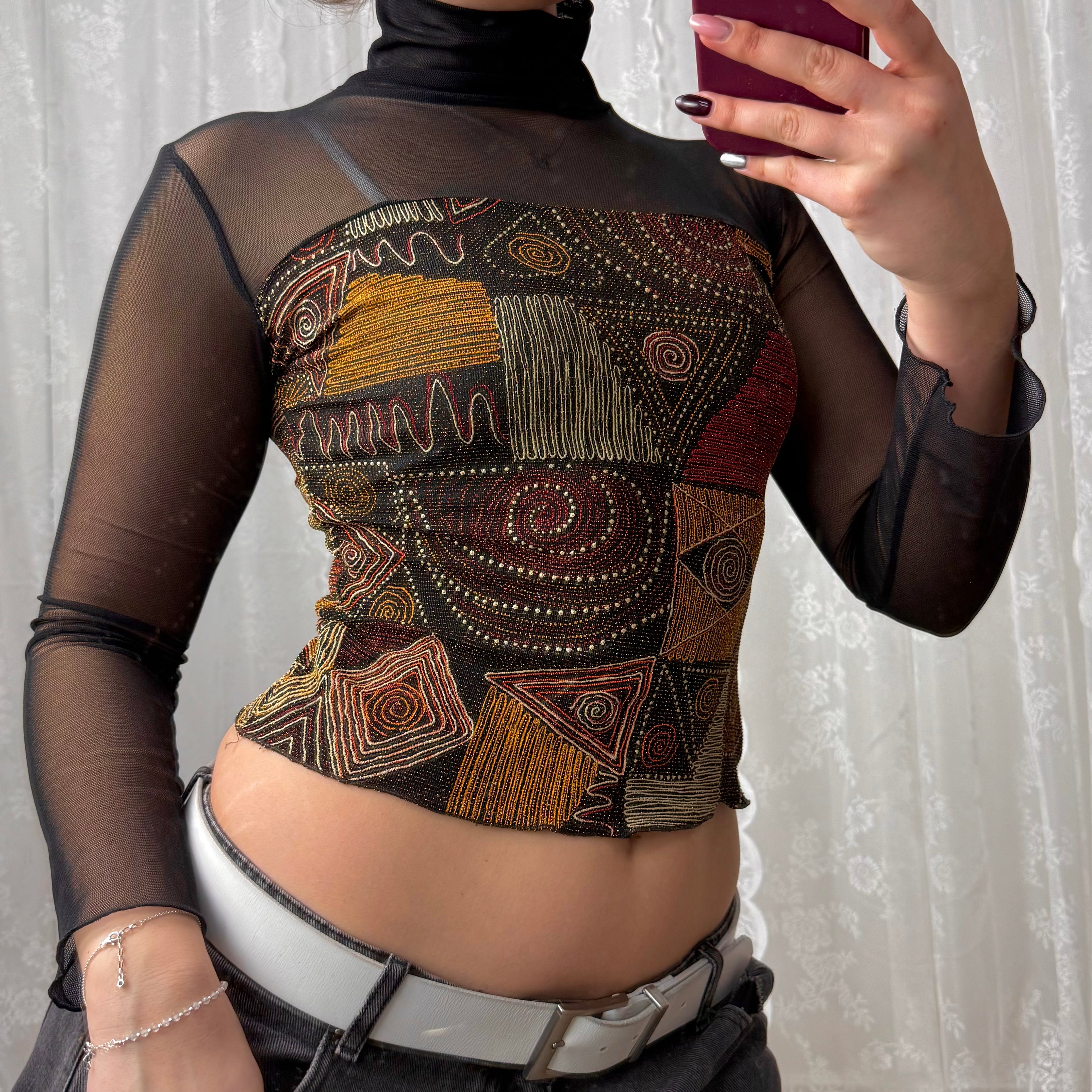 Black mesh long sleeved turtleneck with glittery pattern