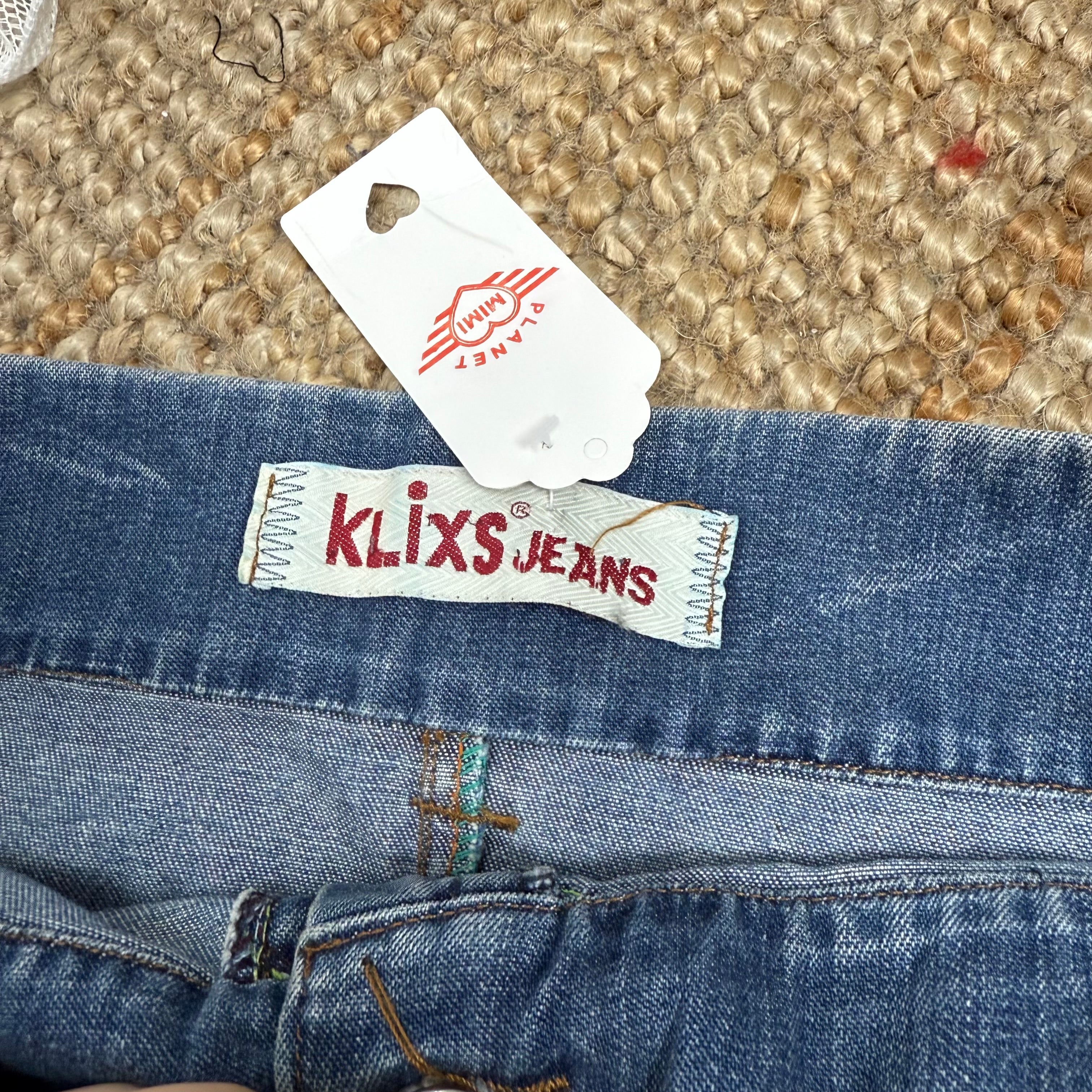 Blue washed denim mini skirt with button and zip detailing