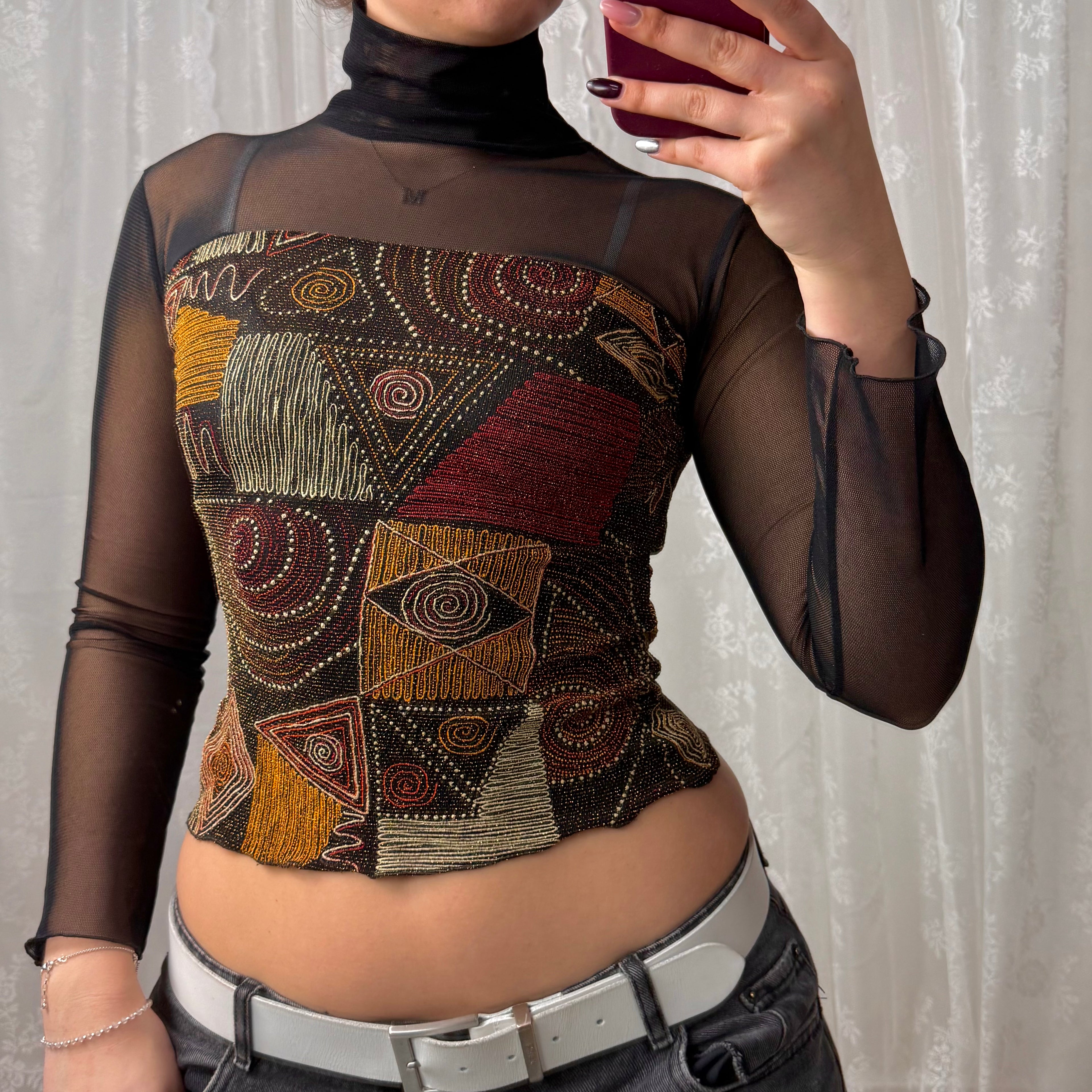 Black mesh long sleeved turtleneck with glittery pattern