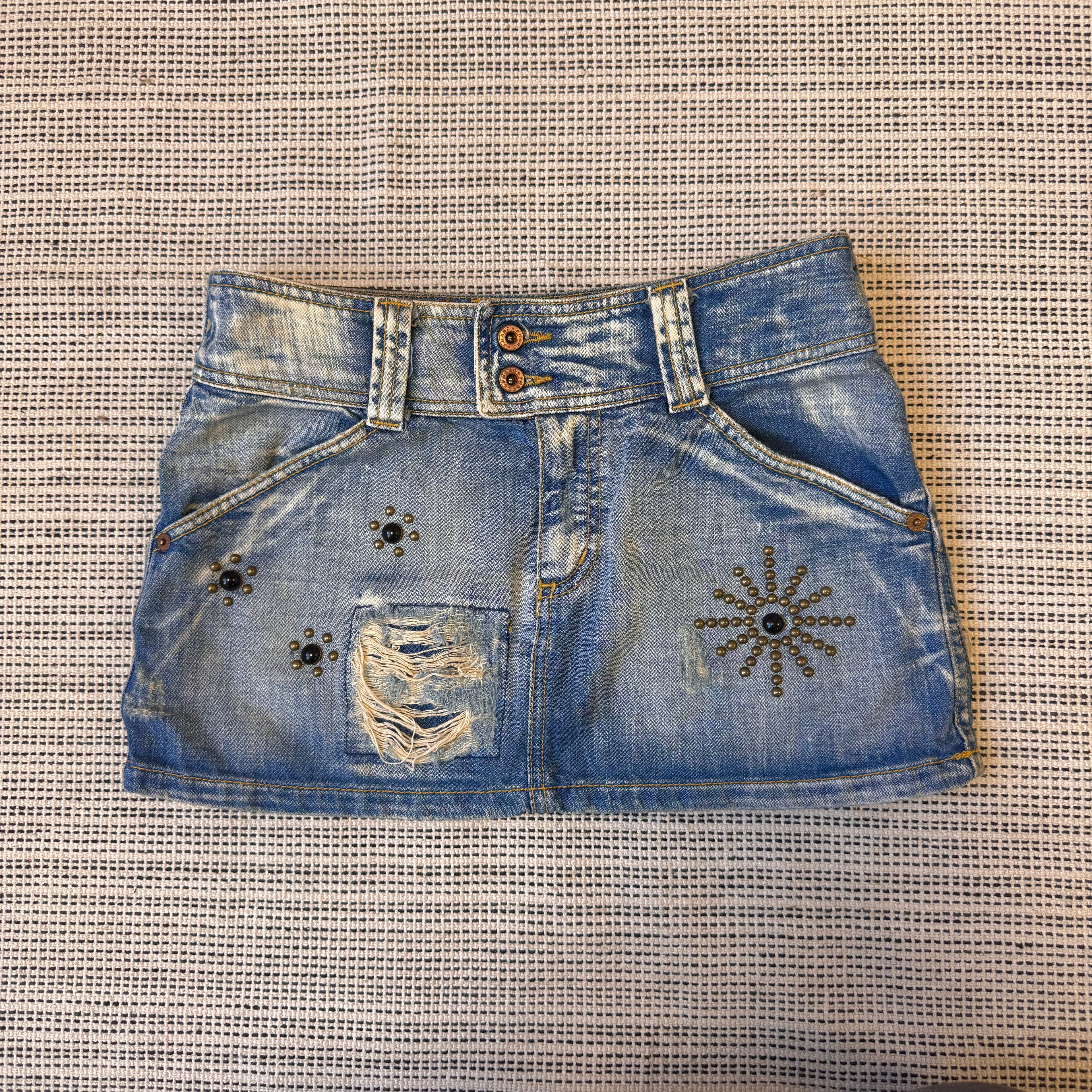 Blue denim distressed stuffed mini skirt