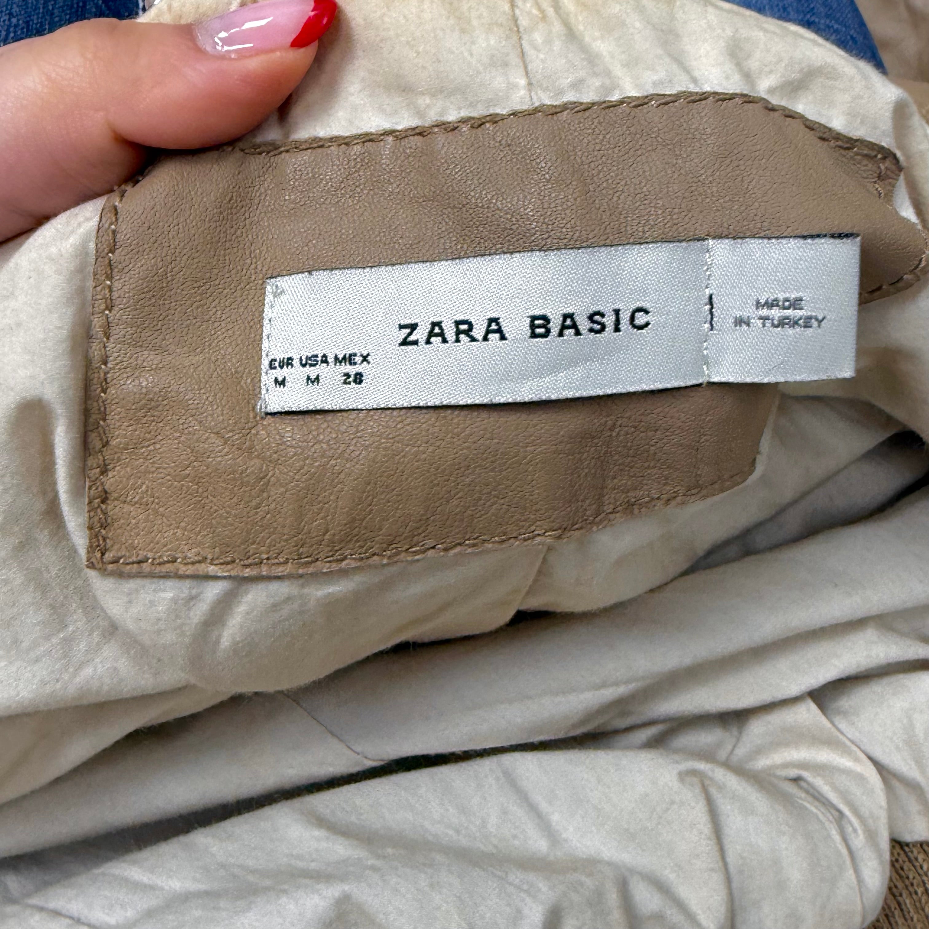 Beige leather bomber jacket