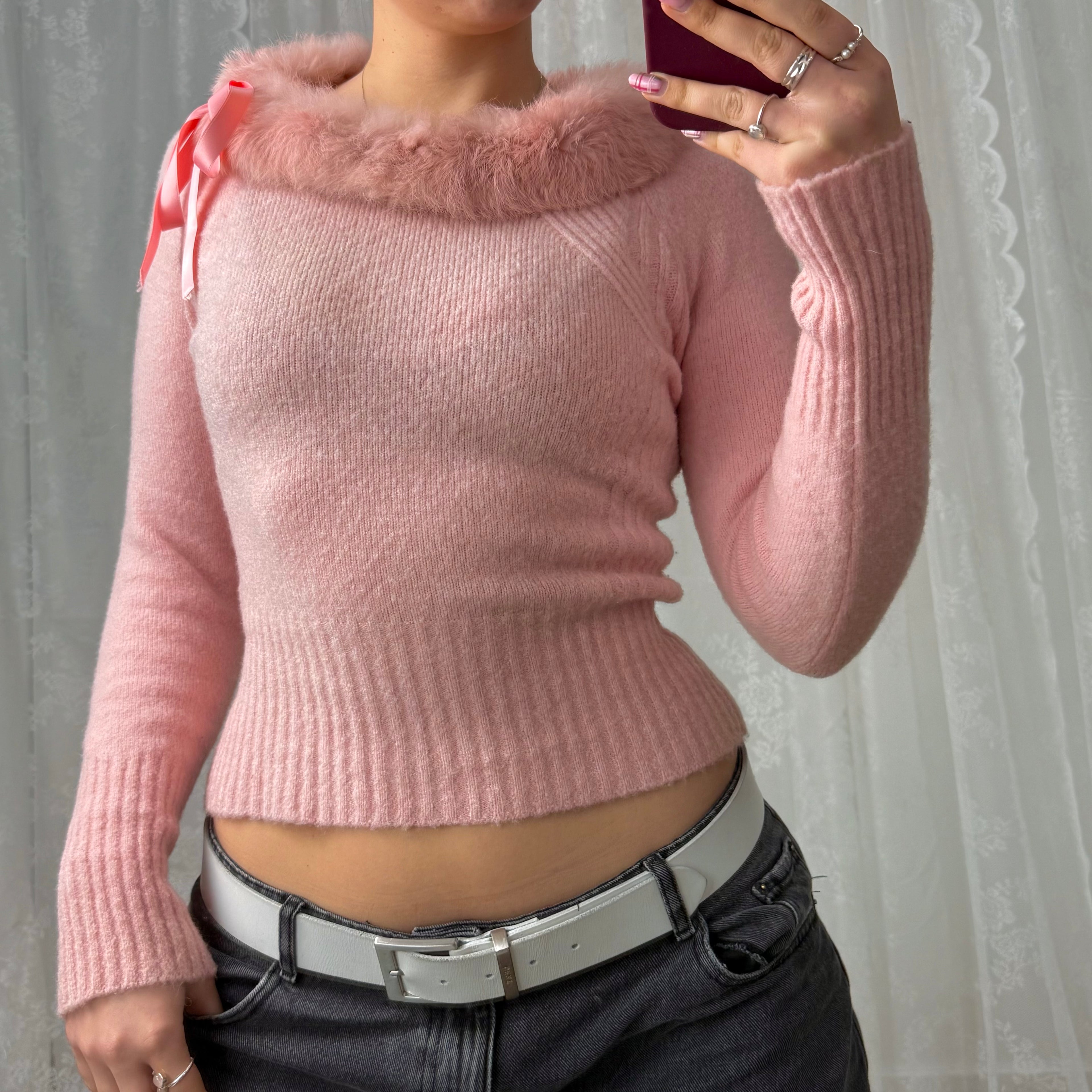 Pink sweater with faux fur trim and bow detailing