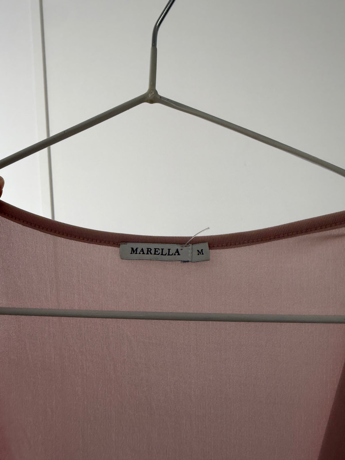 Pink wrapped slinky top