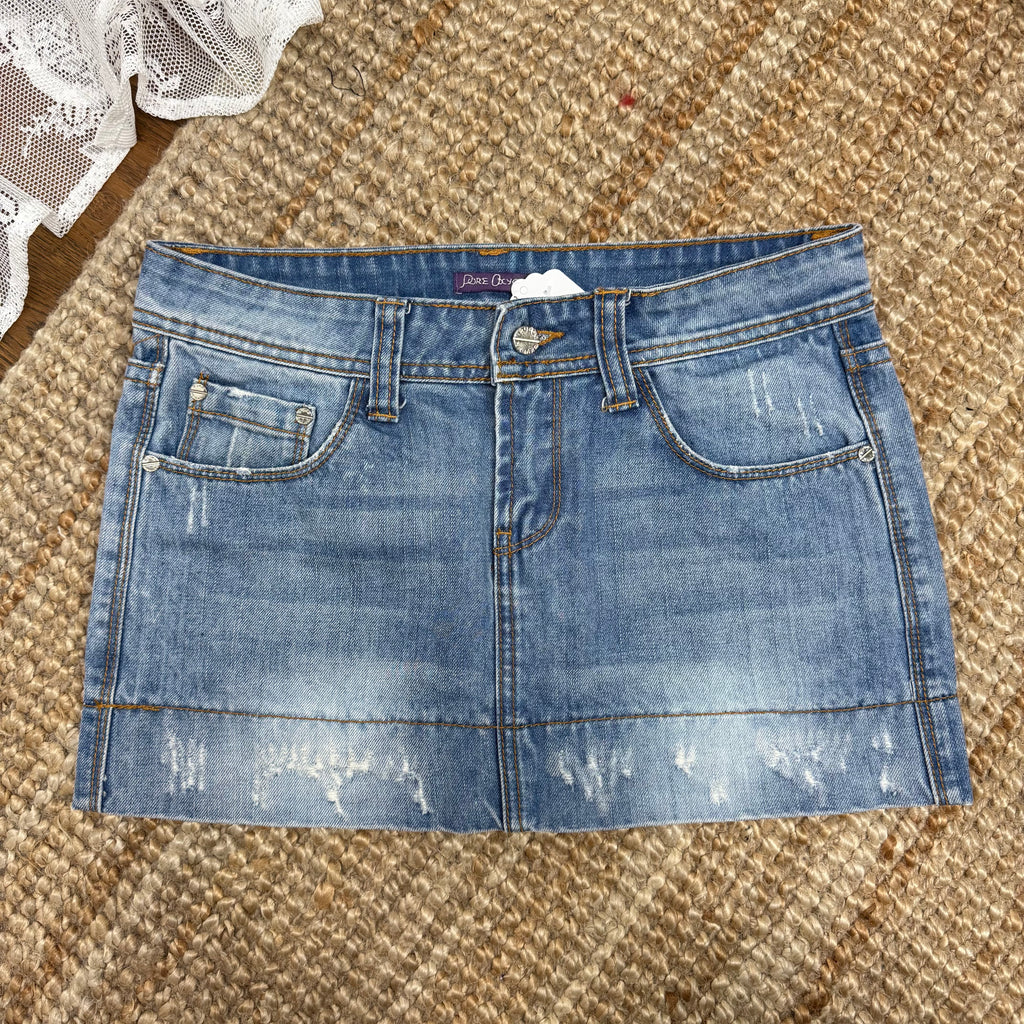 Light blue denim mini skirt with distressed detailing