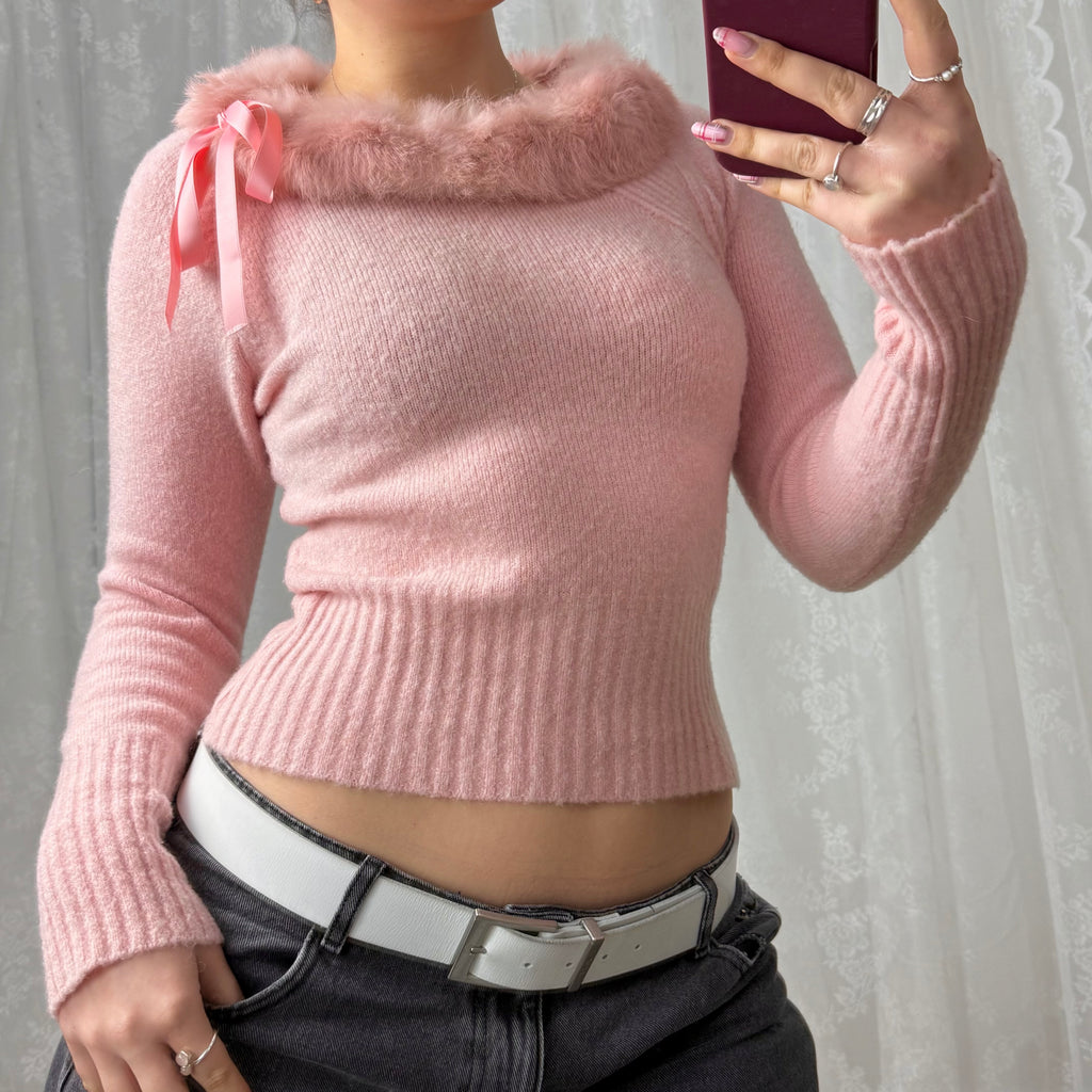 Pink sweater with faux fur trim and bow detailing
