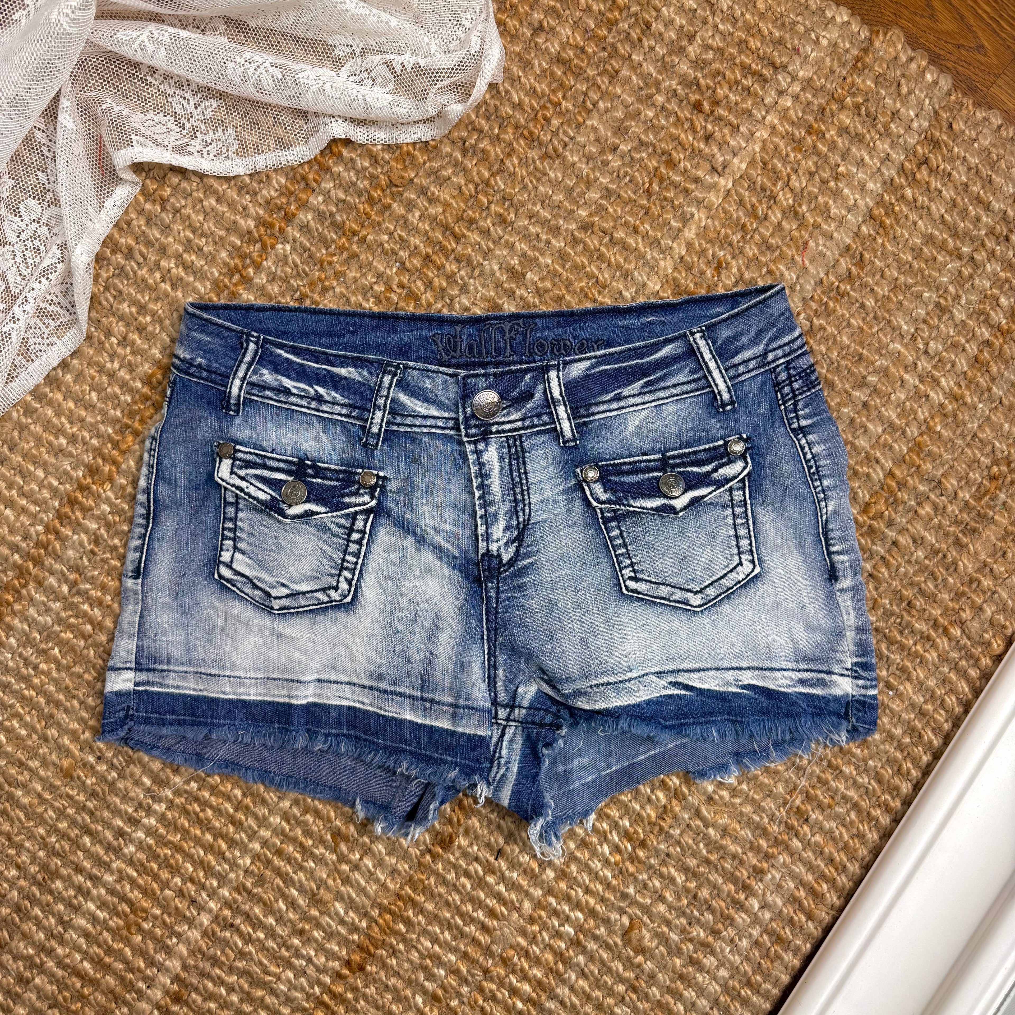 Blue denim studded mini shorts
