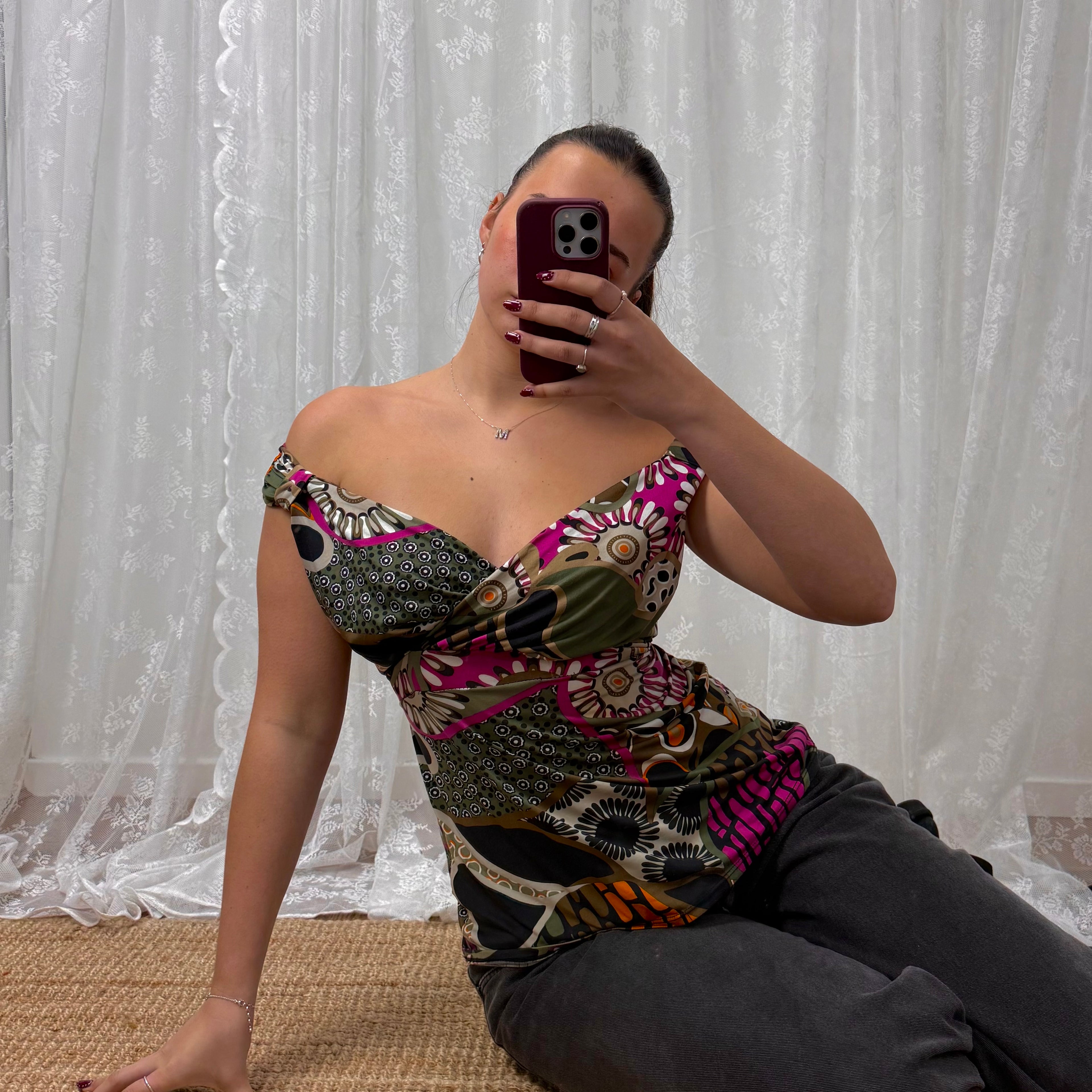 Green slinky patterned off the shoulder top