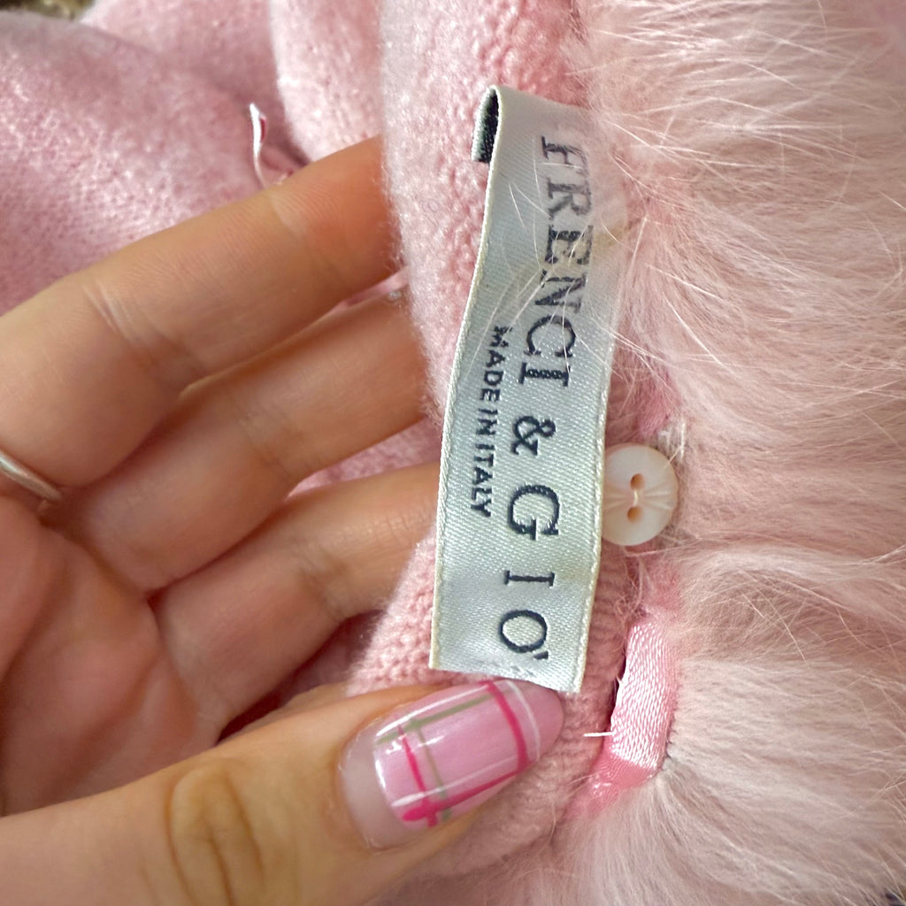 Pink sweater with faux fur trim and bow detailing
