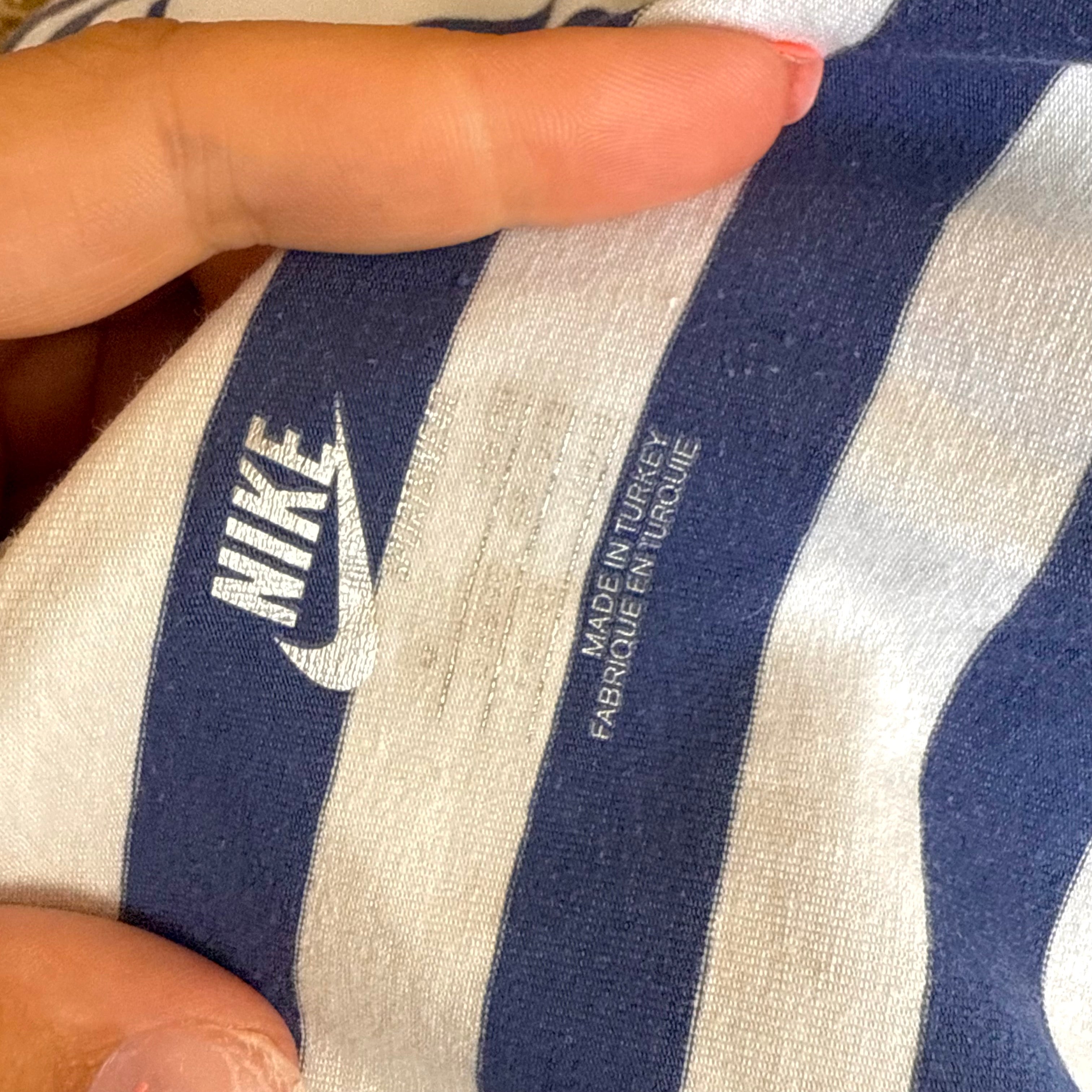 Blue and white striped hoodied long sleeved top