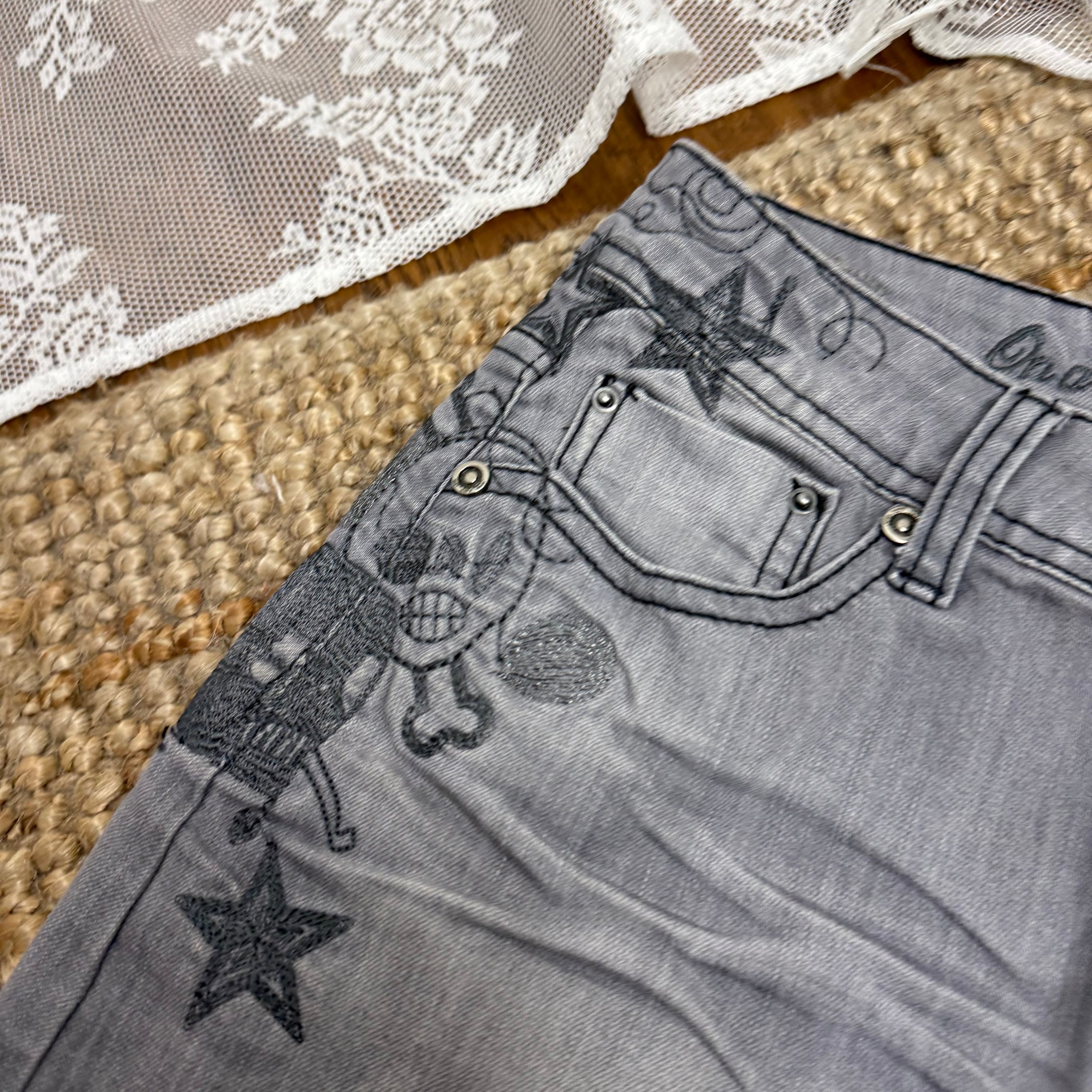 Grey denim embroided mini skirt