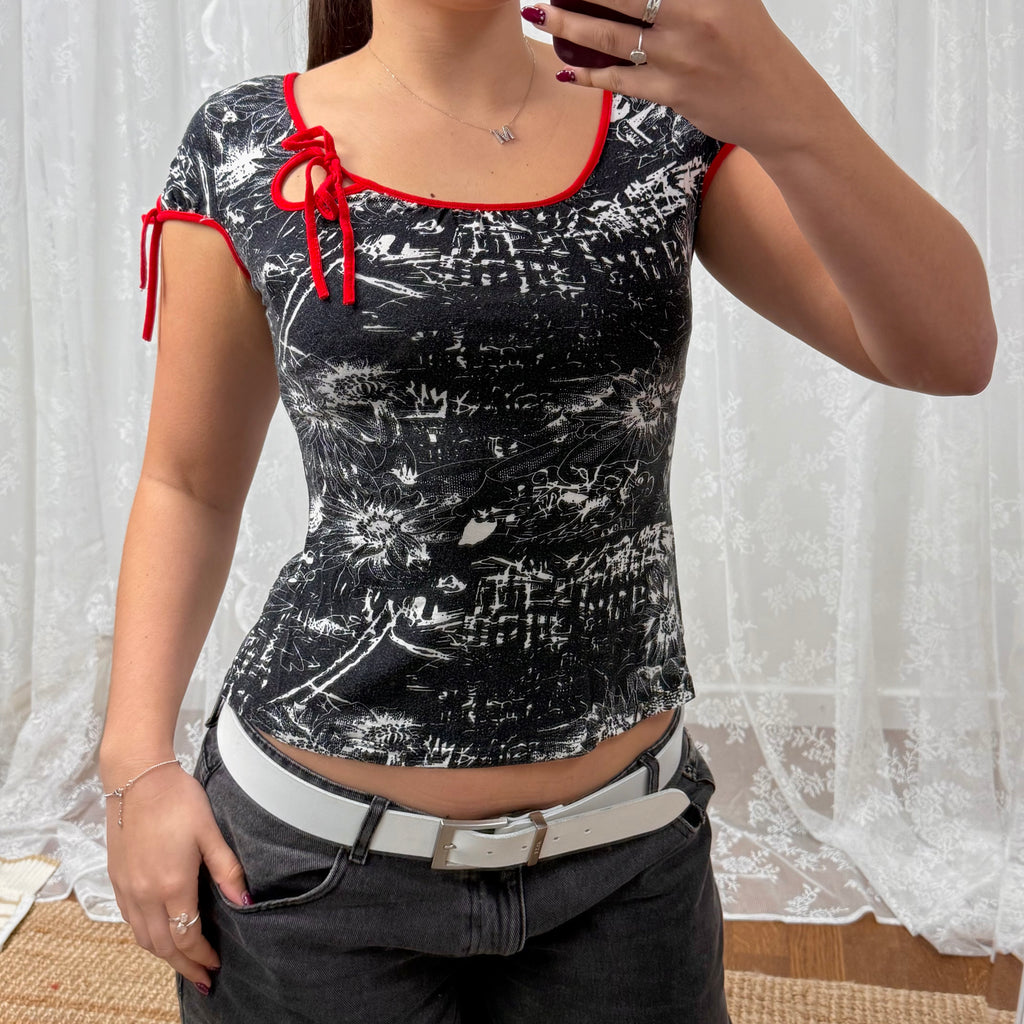 Black and white patterned top with red detailing