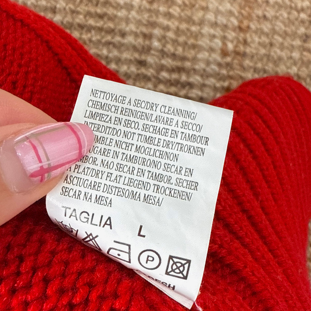 Red knitted zip up sweater