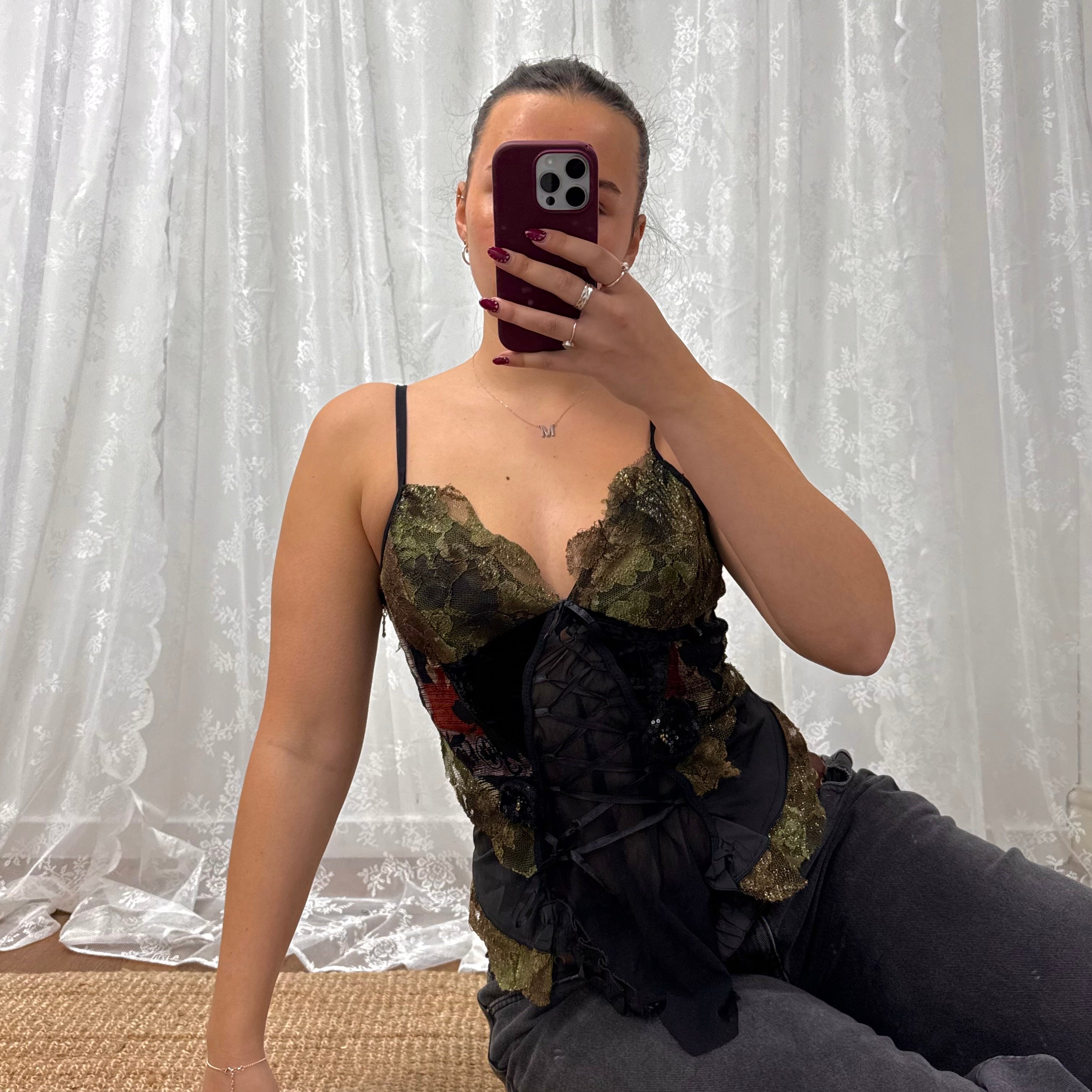 Black and green shiny corset style top