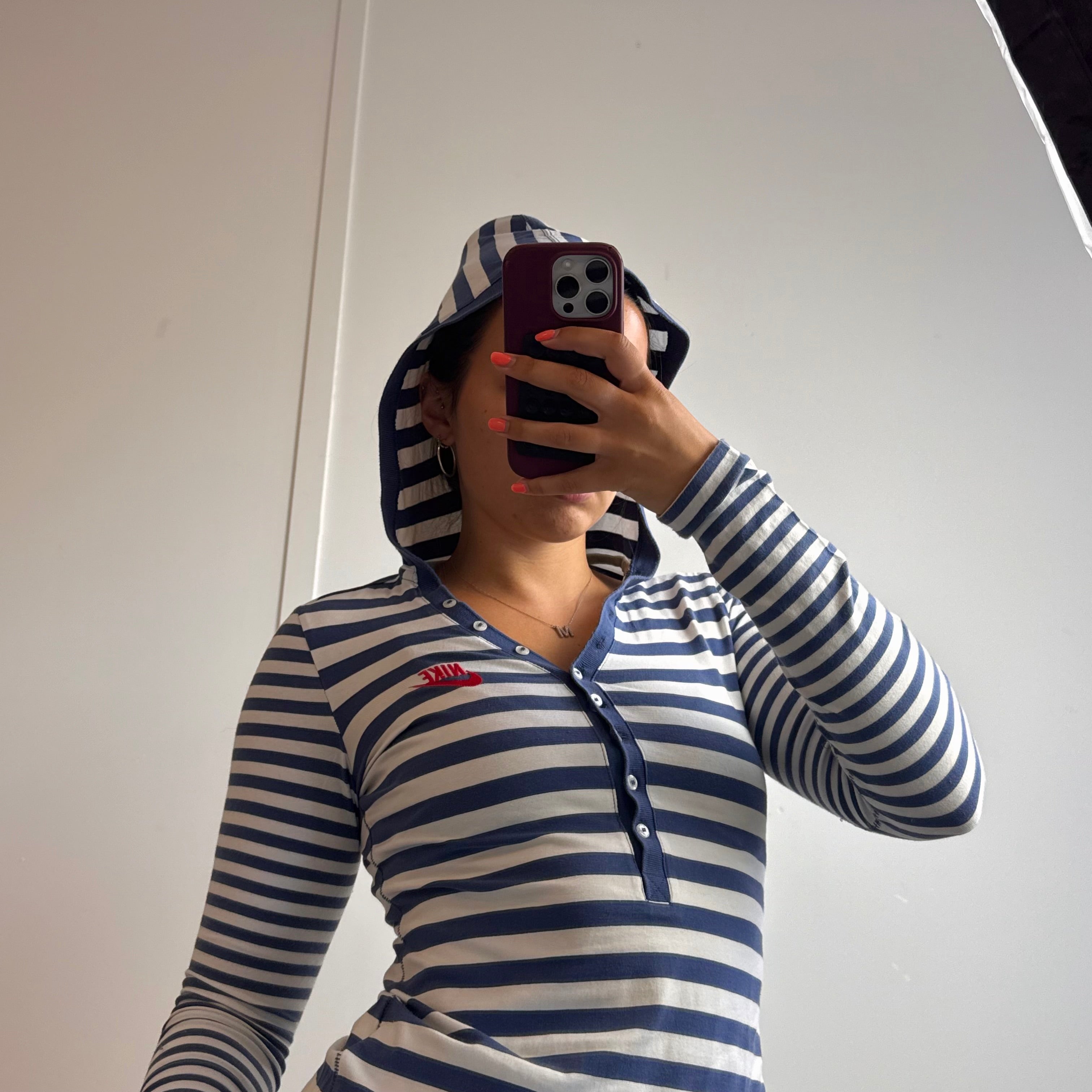 Blue and white striped hoodied long sleeved top