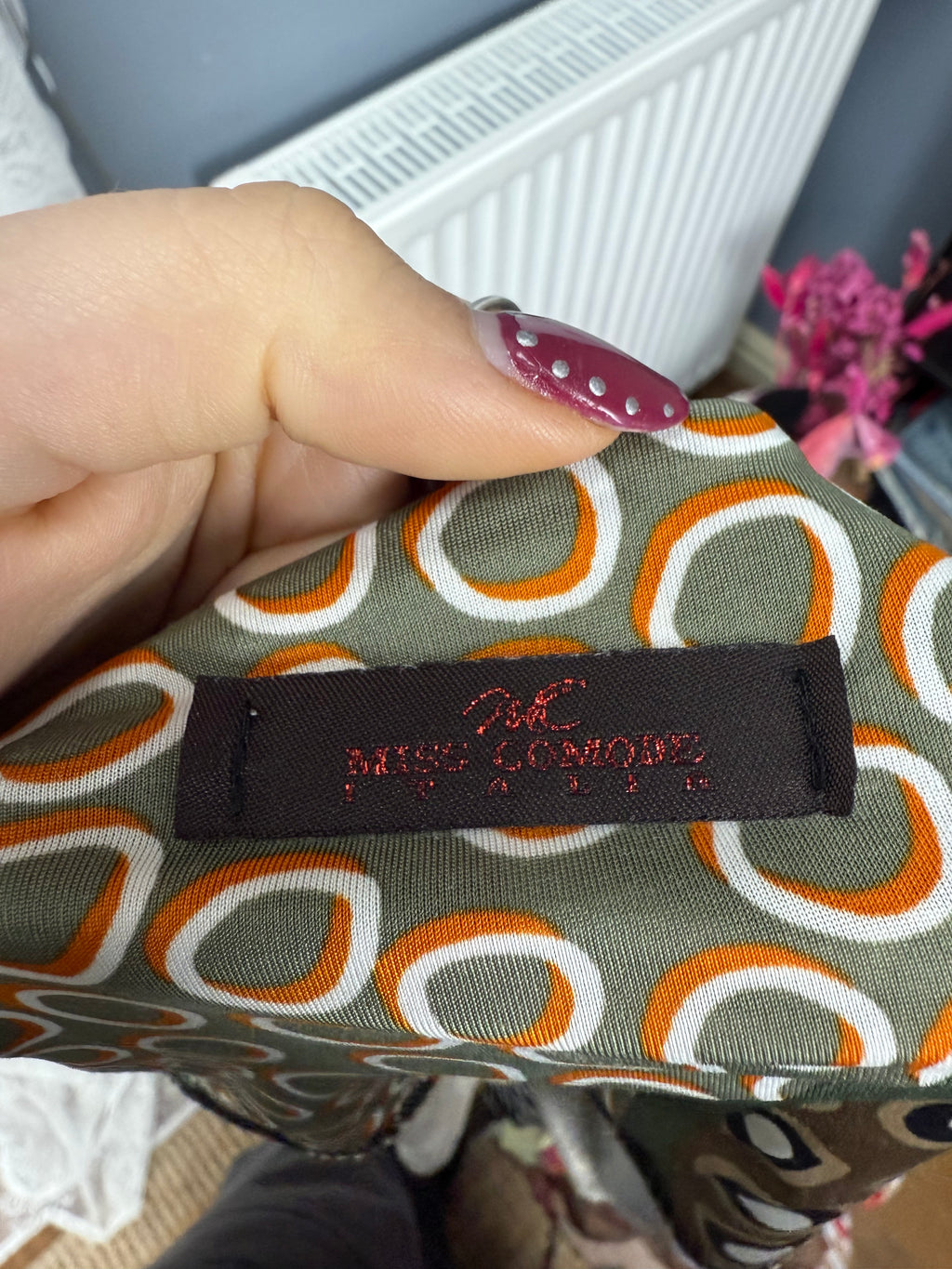 Green slinky patterned off the shoulder top