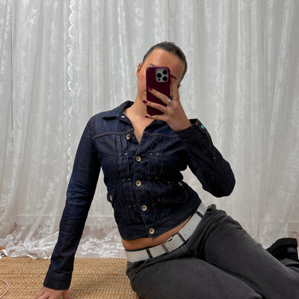 Dark denim fitted jacket with pleated detailing and silver buttons