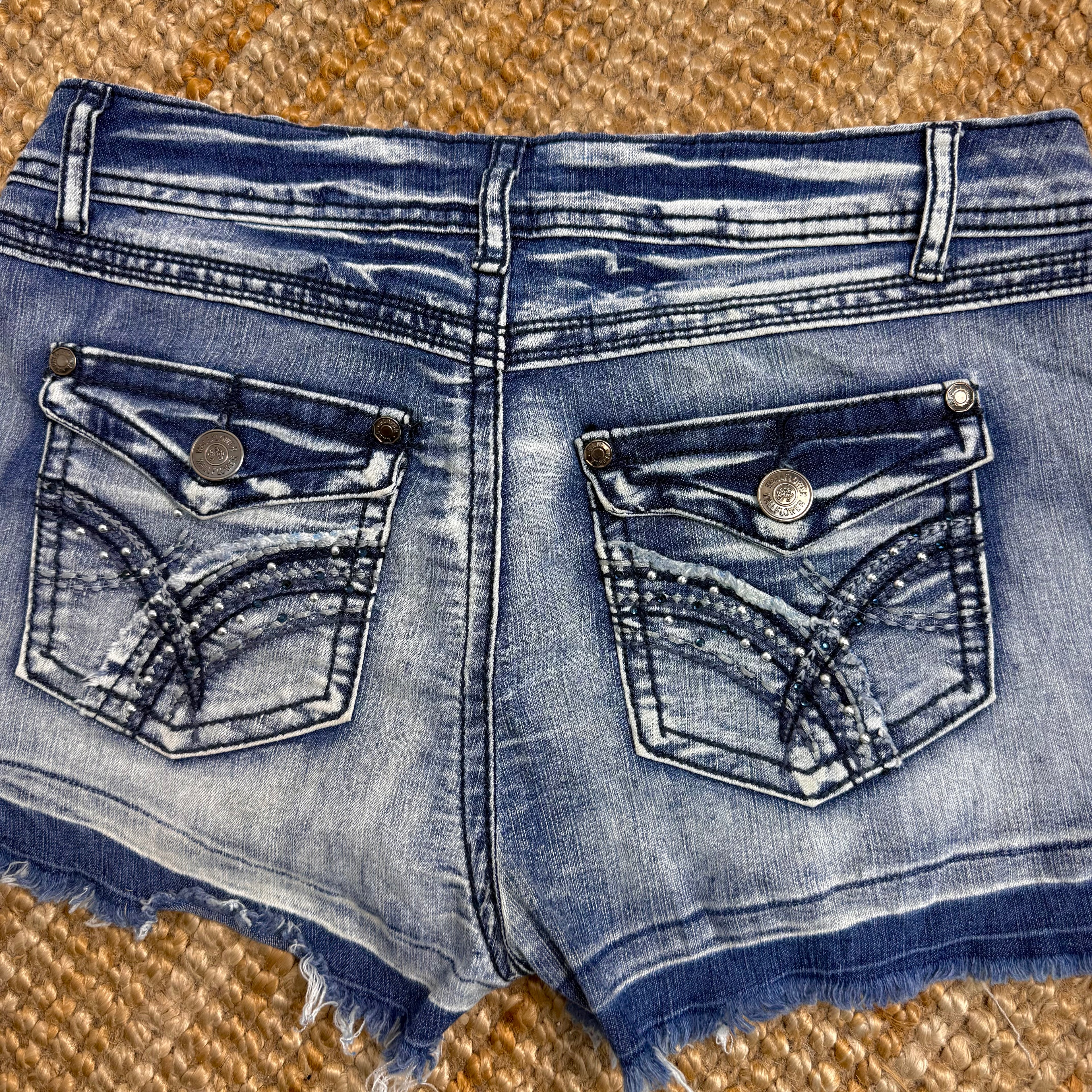 Blue denim studded mini shorts