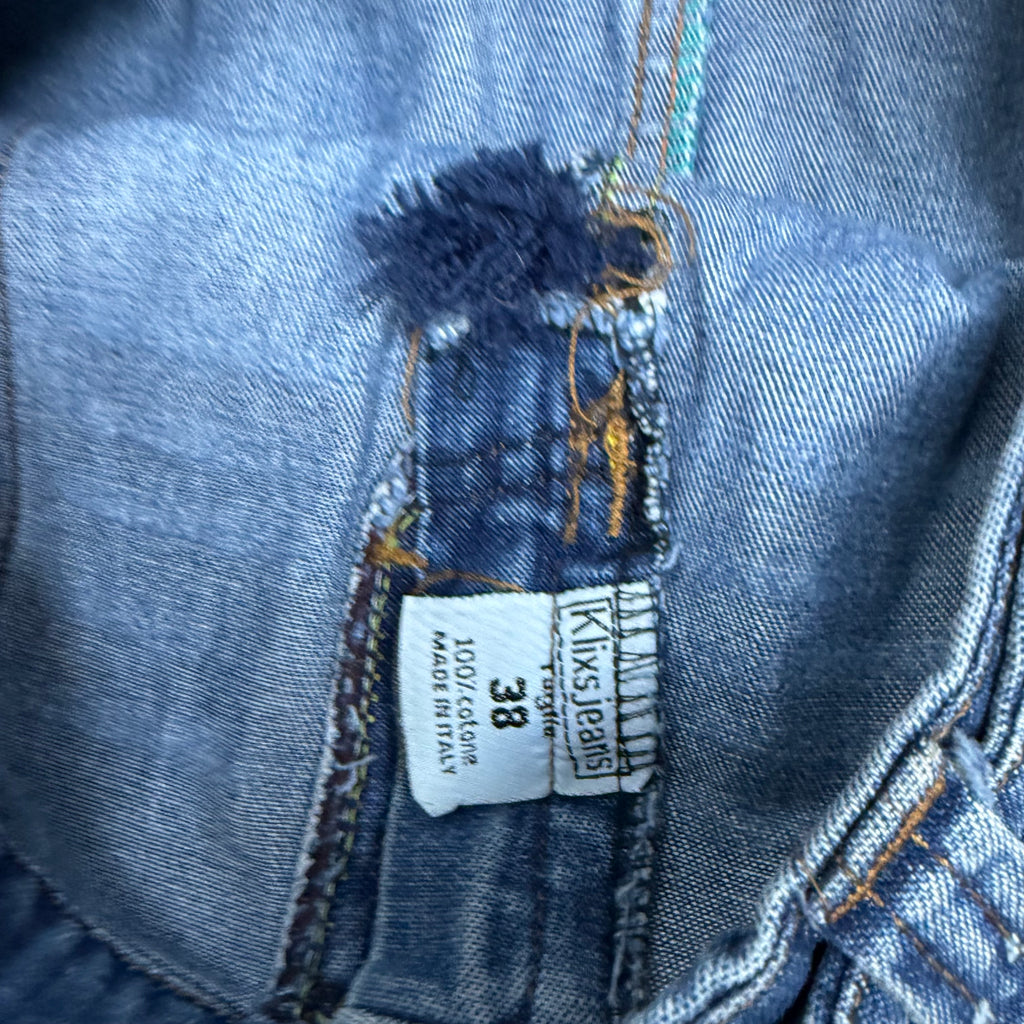 Blue washed denim mini skirt with button and zip detailing