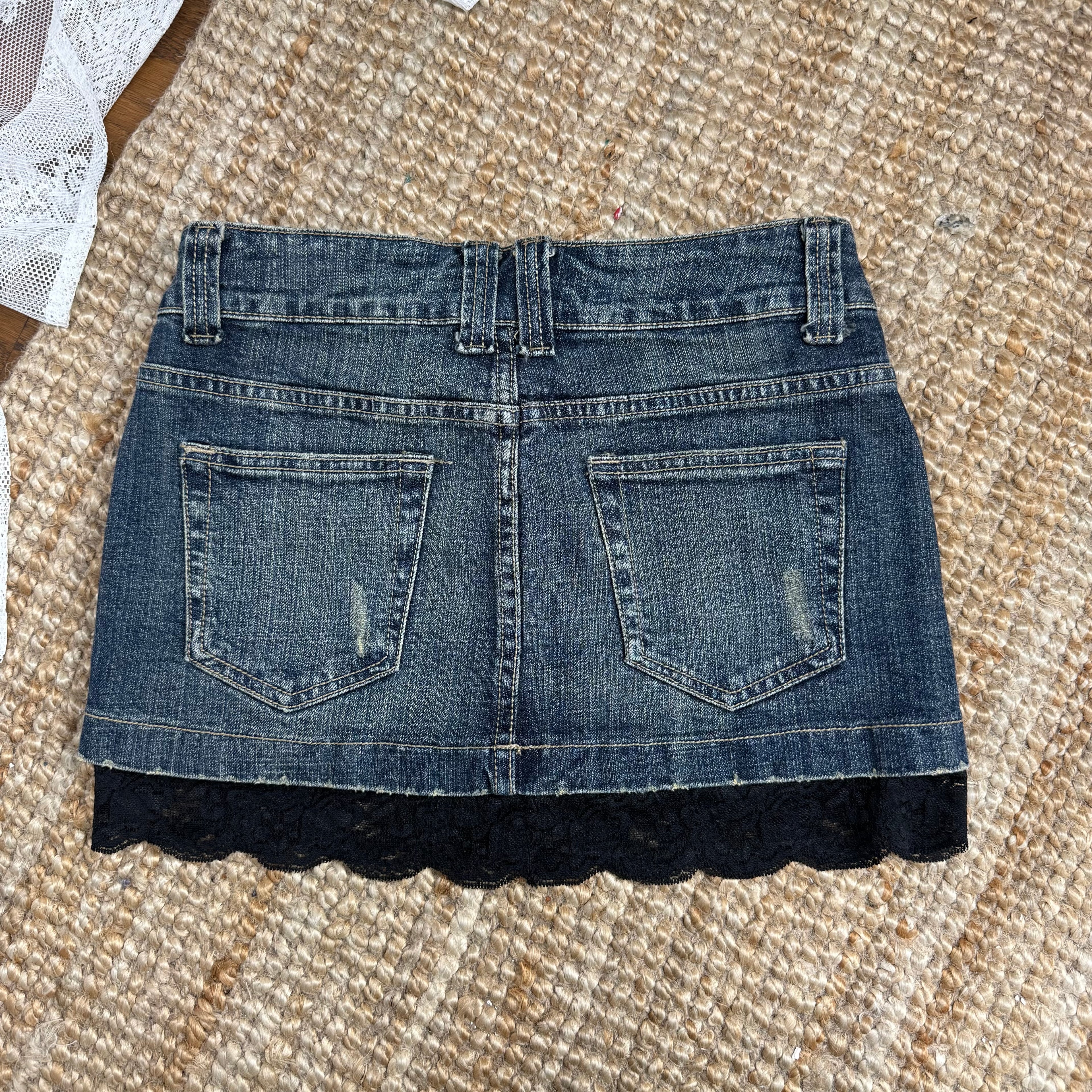 Blue denim mini skirt with black lace