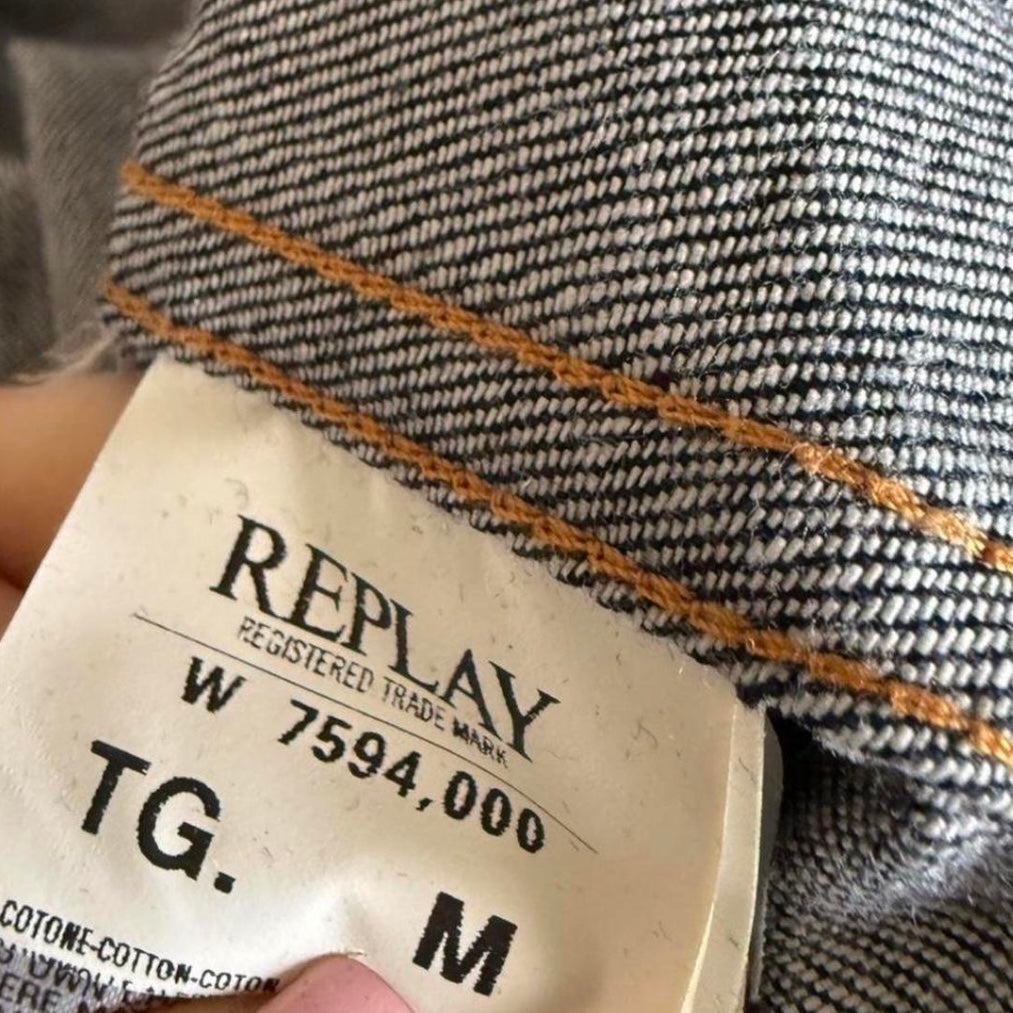 Dark denim fitted jacket with pleated detailing and silver buttons