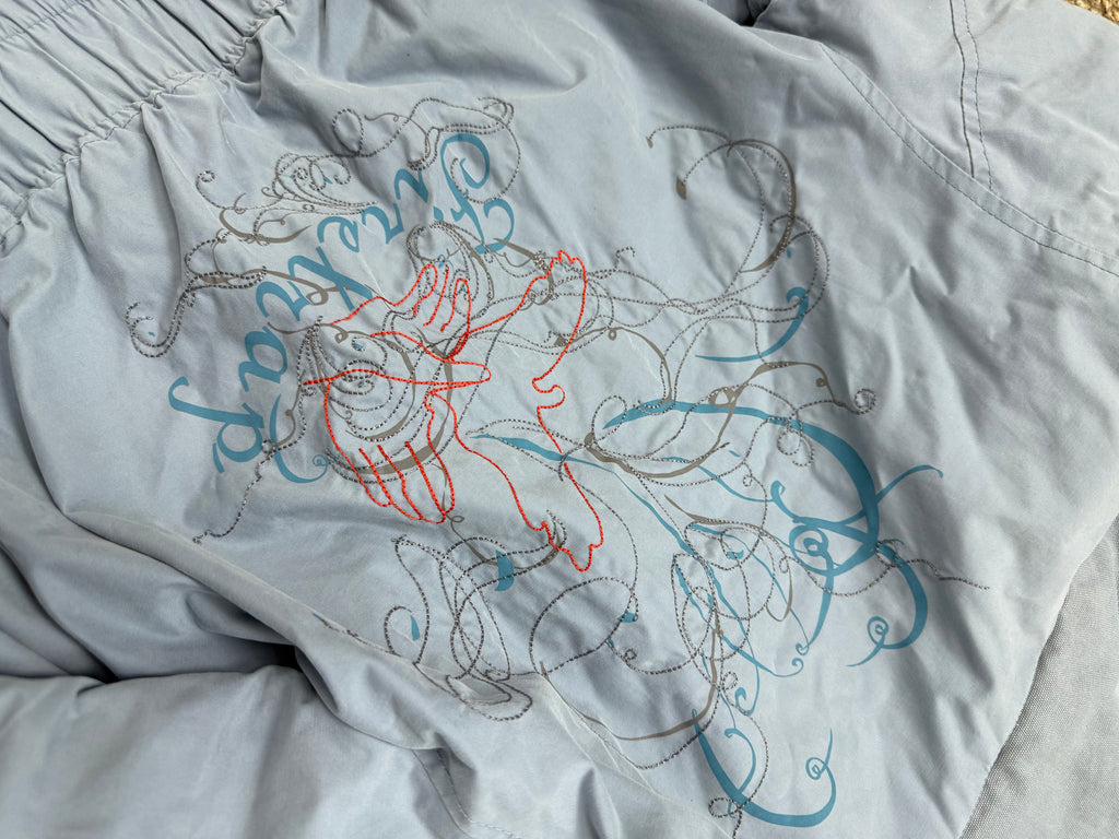 Blue padded cargo jacket with embroidered back