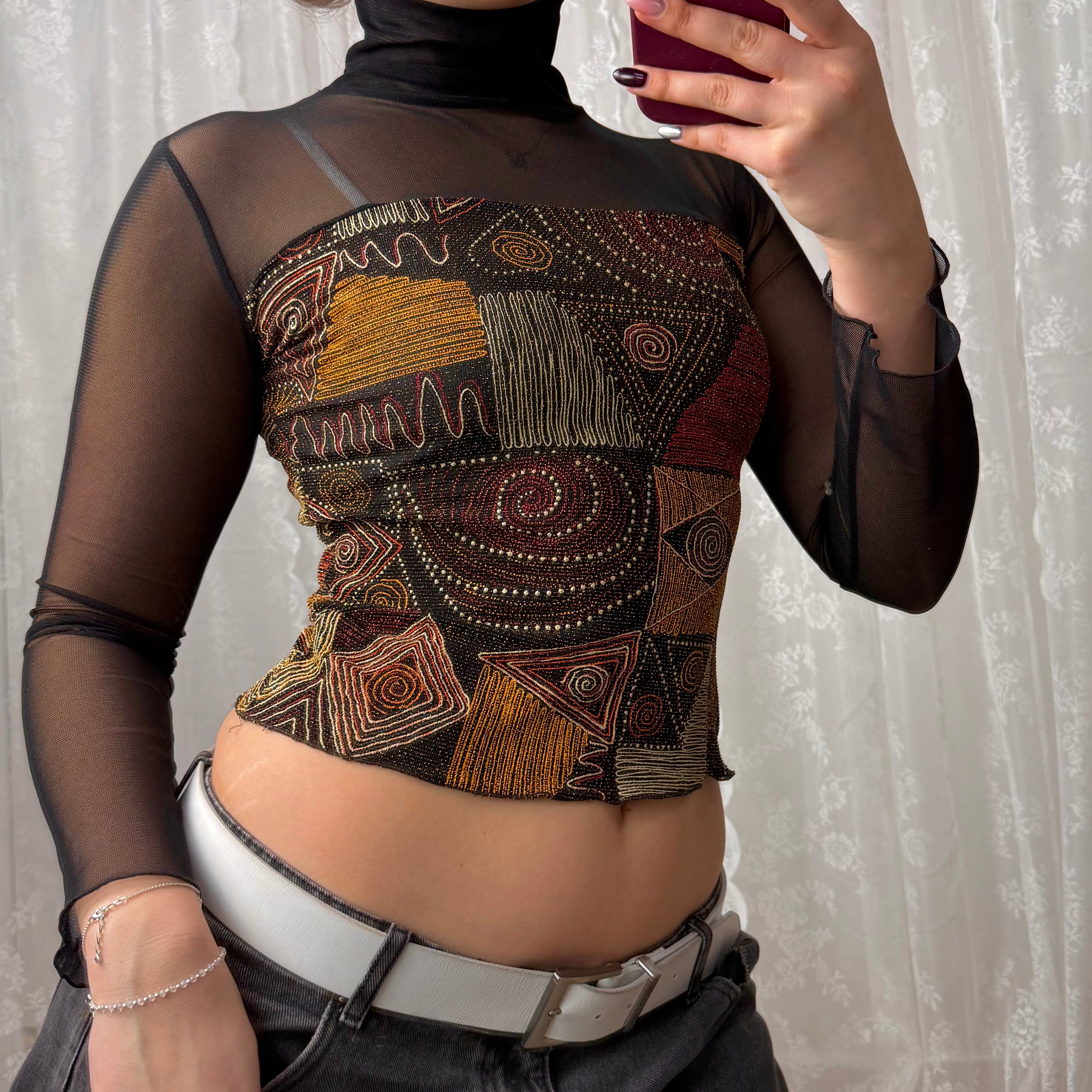 Black mesh long sleeved turtleneck with glittery pattern
