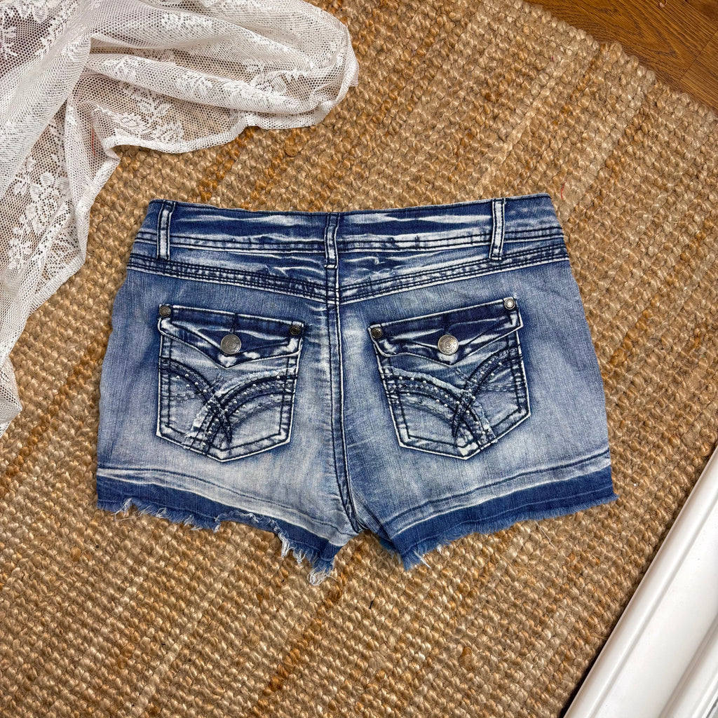 Blue denim studded mini shorts