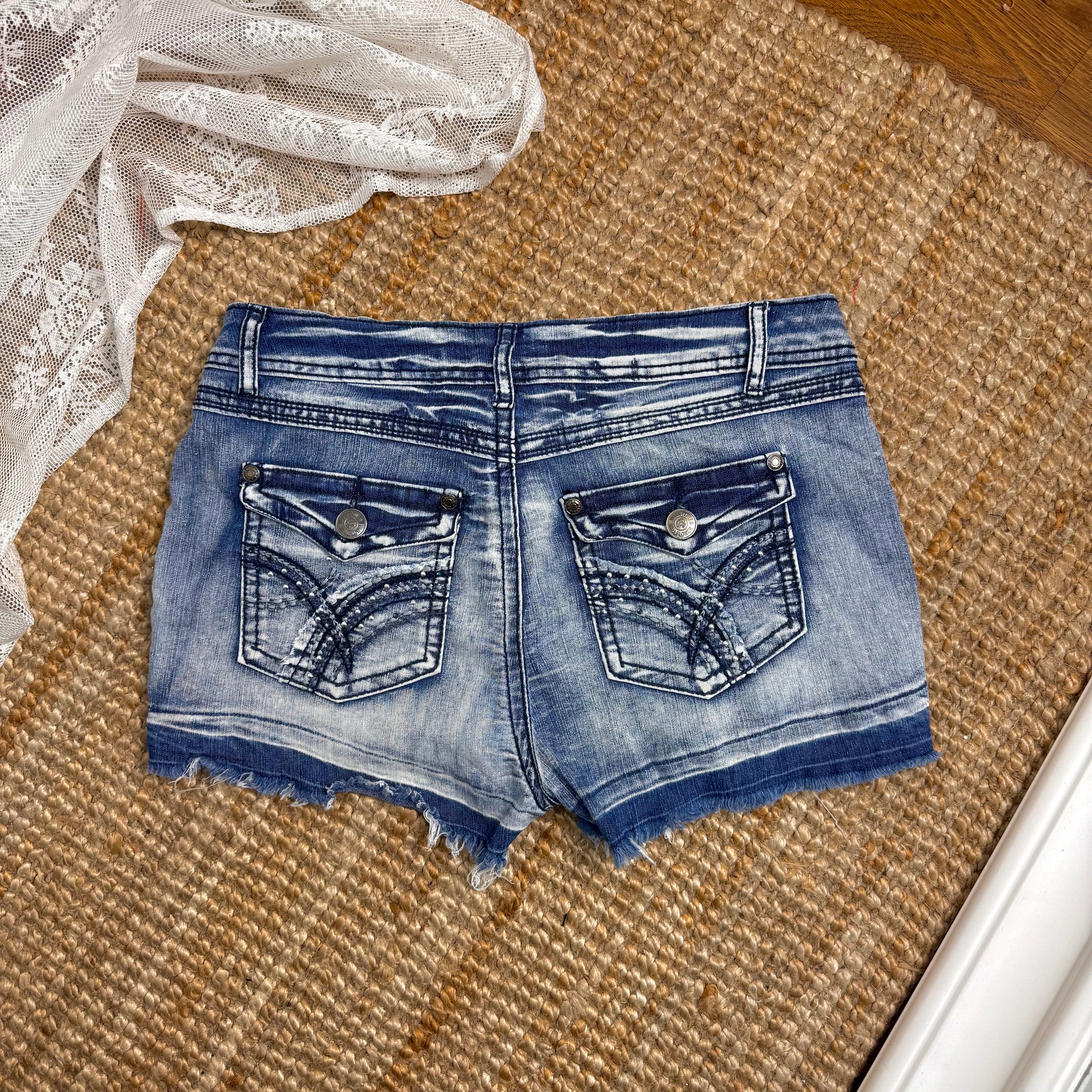 Blue denim studded mini shorts