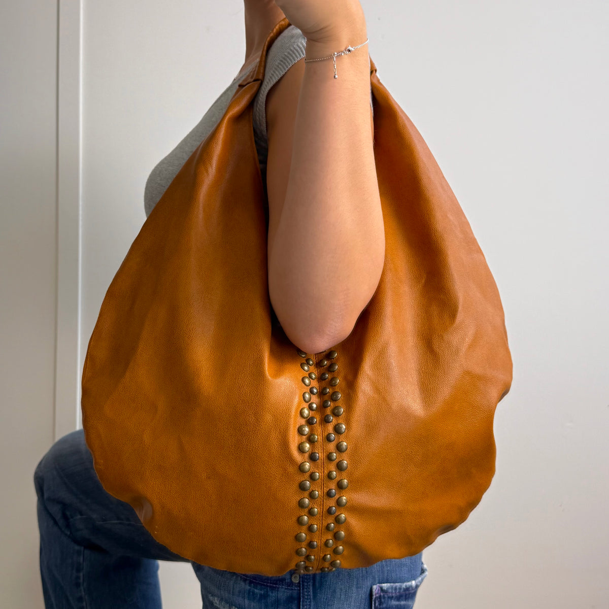 Brown studded large hobo bag