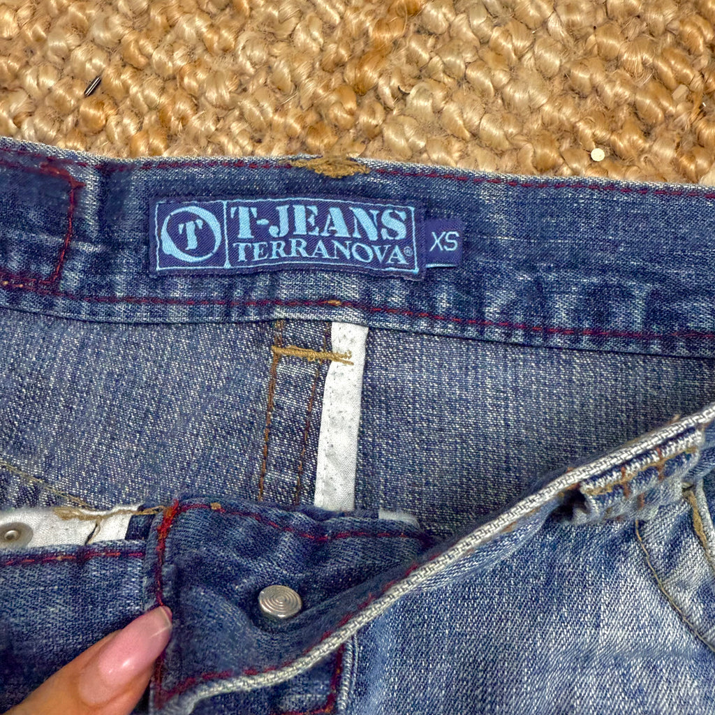 Blue denim low waisted distressed mini skirt