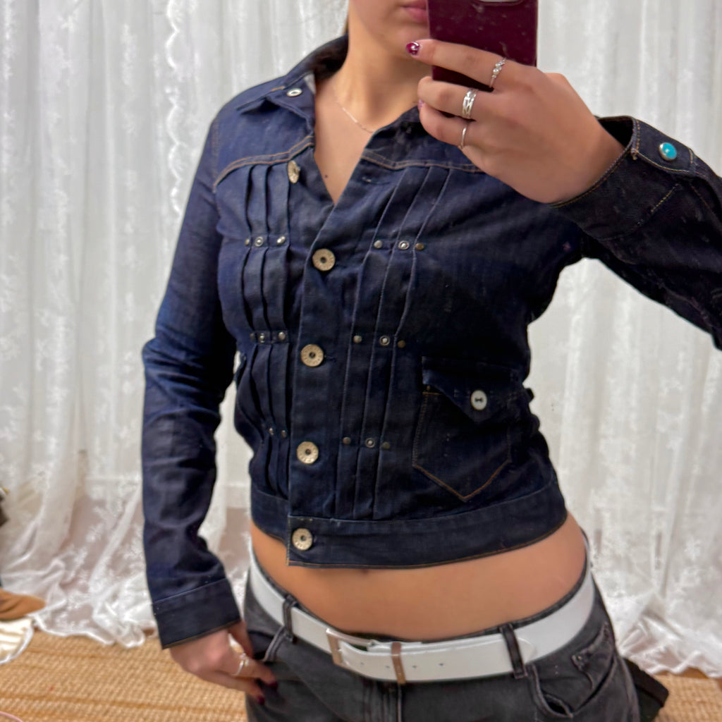 Dark denim fitted jacket with pleated detailing and silver buttons