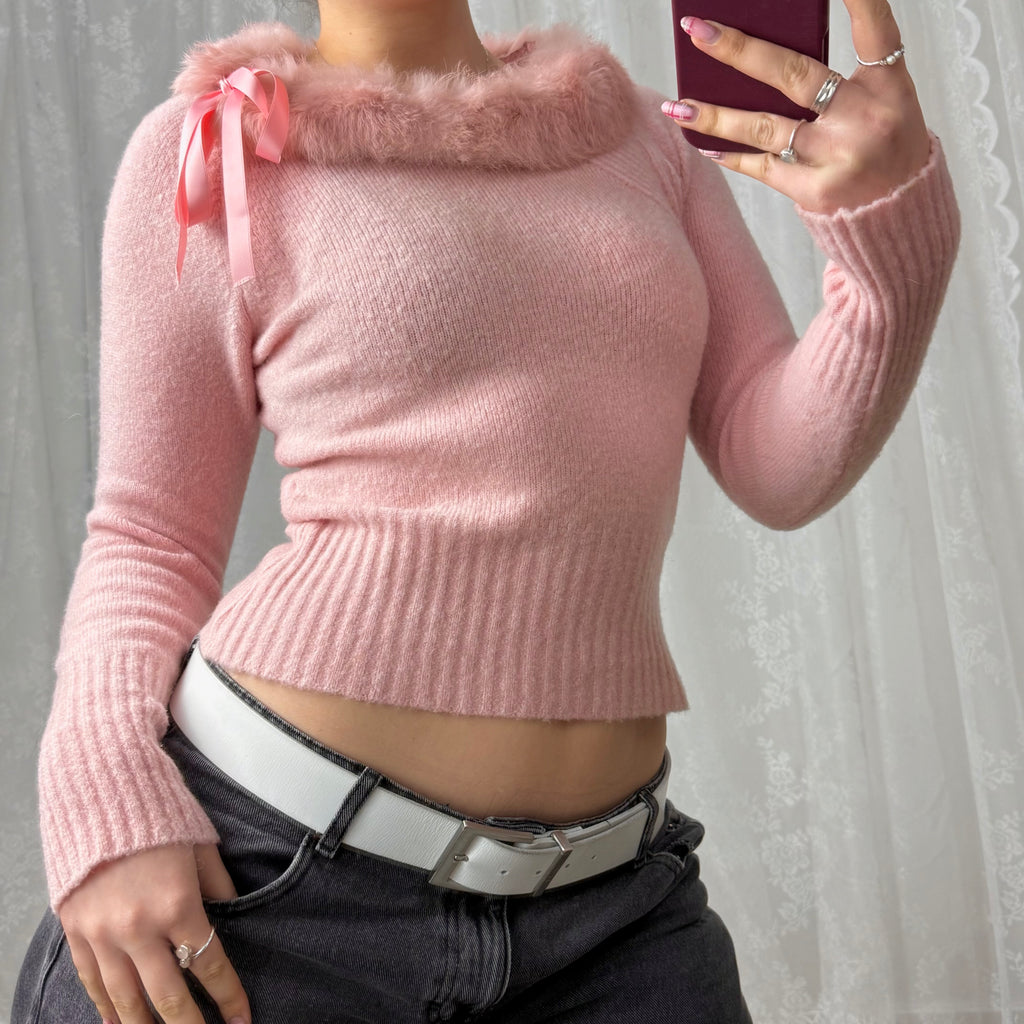 Pink sweater with faux fur trim and bow detailing
