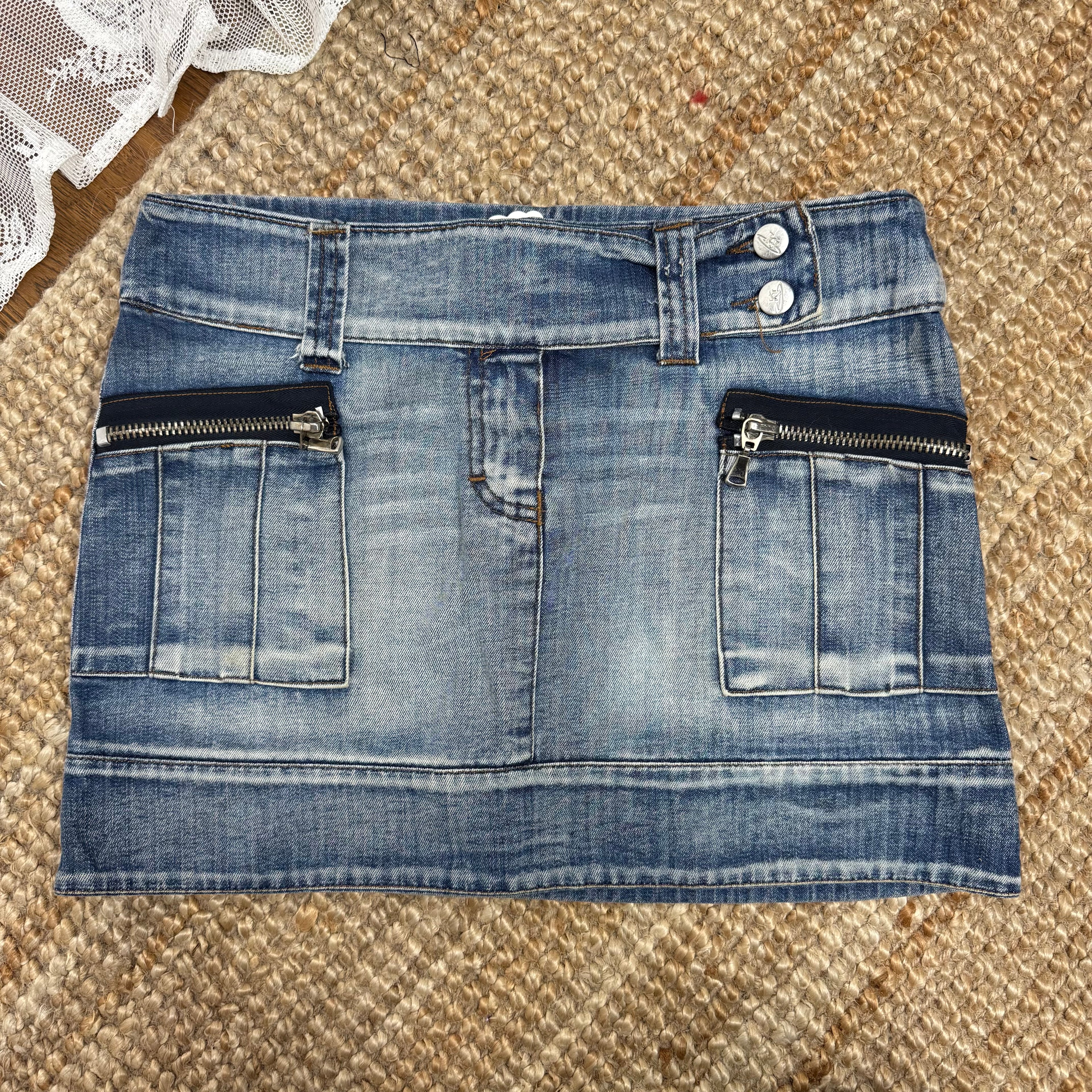 Blue washed denim mini skirt with button and zip detailing