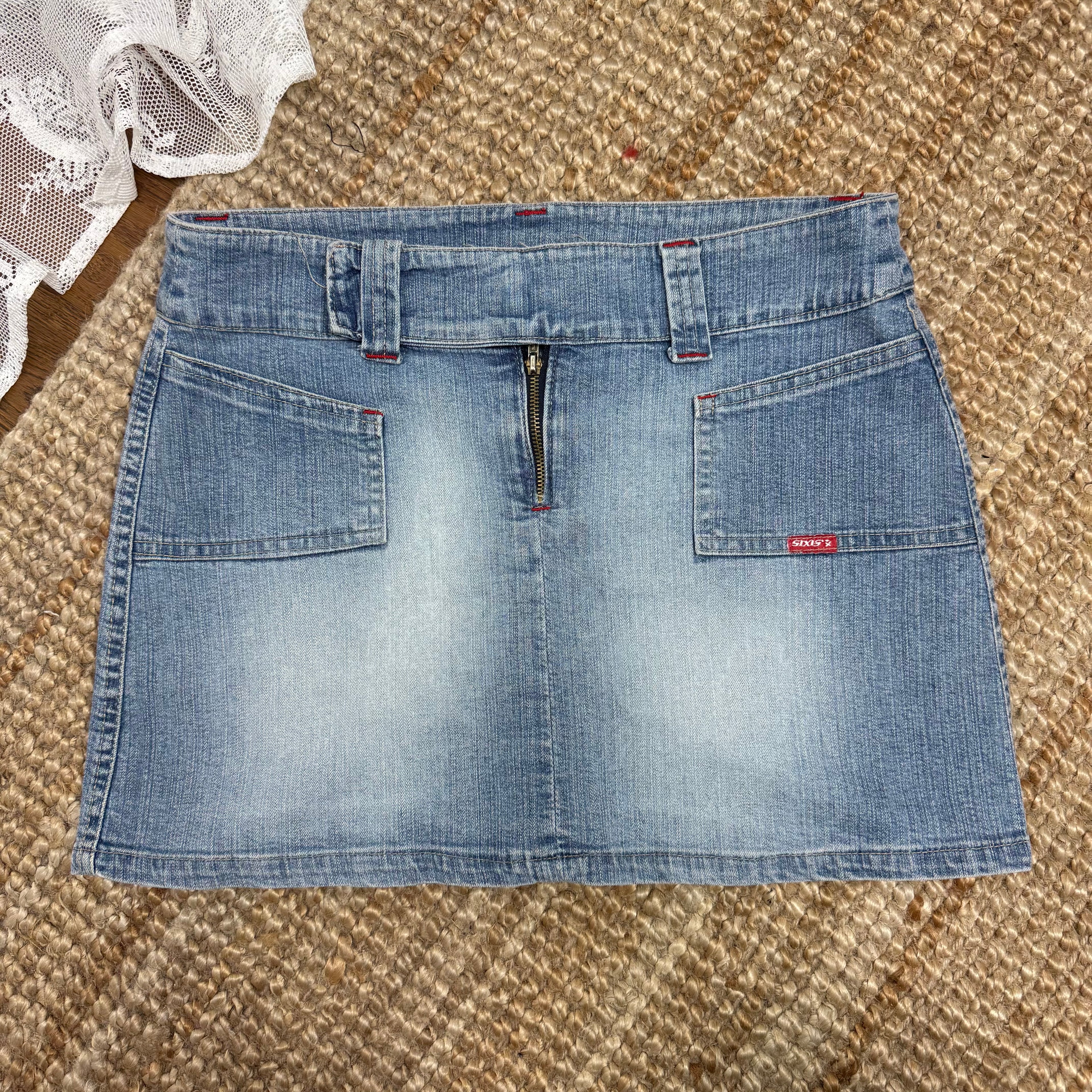 Light wash denim mini skirt with waistband detailing