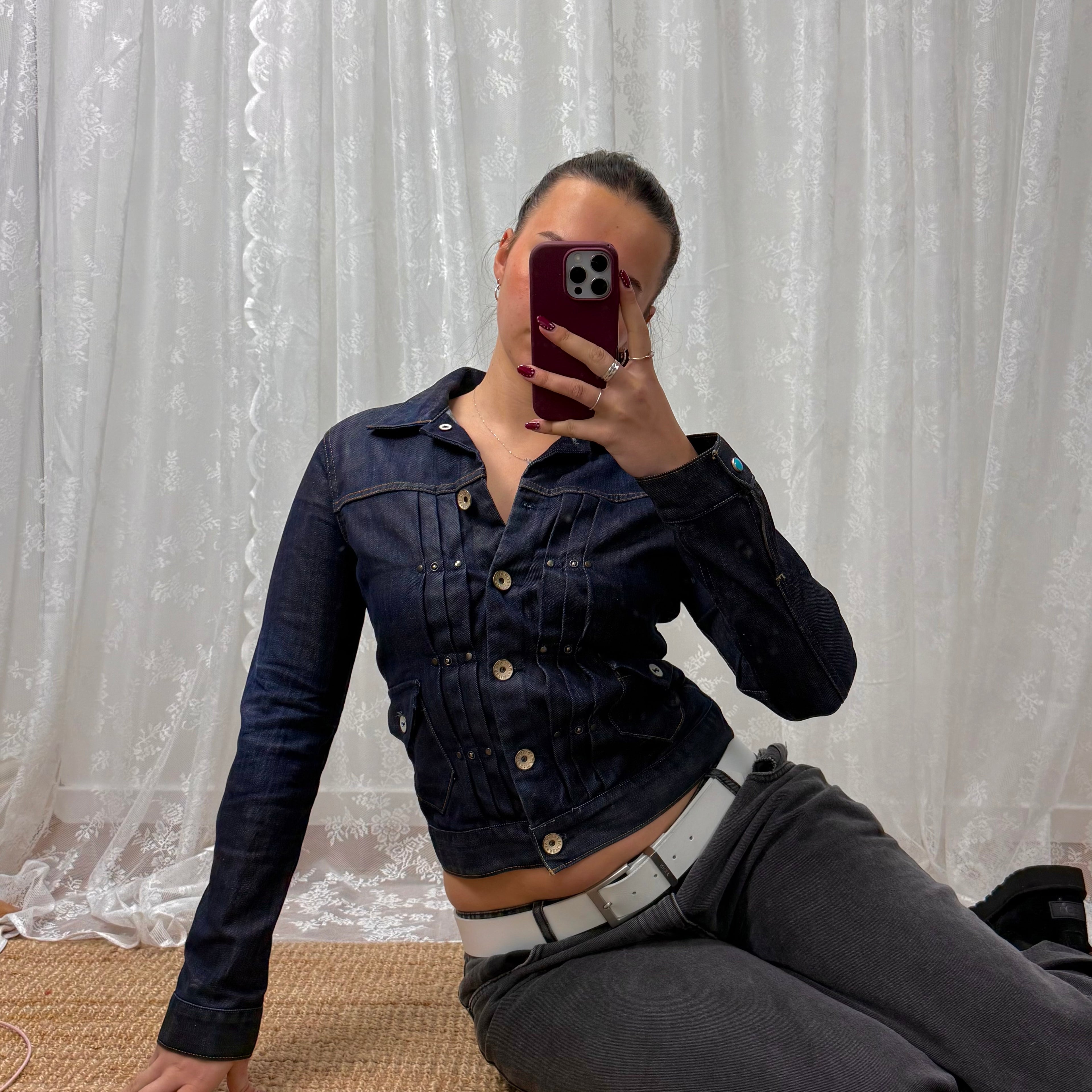 Dark denim fitted jacket with pleated detailing and silver buttons